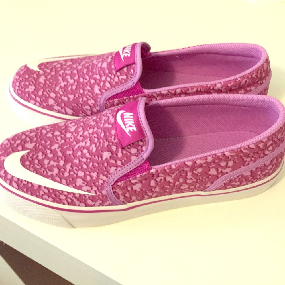 Purple and white Nike slip ons